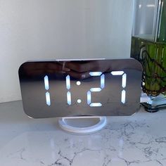 an alarm clock sitting on top of a table