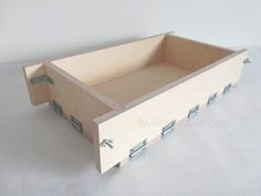 an empty wooden box with metal handles