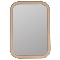 a wooden frame mirror sitting on top of a white wall