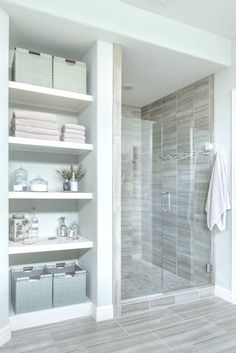 a walk in shower sitting inside of a bathroom