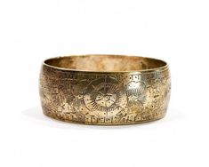 "Adorable silvered solid brass bangle with a beautiful intricate edged floral design. Great vintage condition, a touch of tarnish adds unique character. Inside diameter is 2.75\", and about 1\" wide. NOTE: The beauty of all ethnic jewelry comes to form its distinct rustic feel. There are unique variations in color and texture due to the handmade process." Puka Shell Necklace, Boho Belts, Nature Necklace, Brass Bangle, Puka Shell, Floral Bracelet, Handmade Bangles, Bracelet Cuff, Bangle Set