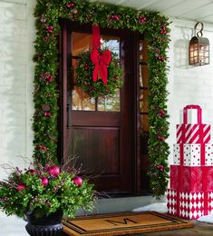 christmas decorations and presents are on the front porch