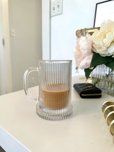 a coffee cup sitting on top of a white counter