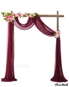 an arch decorated with pink flowers and greenery for a wedding ceremony or special occasion