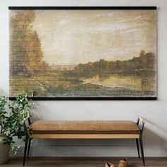 a large painting hanging on the wall above a bench with two shoes next to it