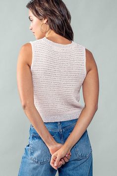 Unleash your inner style with our chic Checkmate top. This sleeveless crochet knit top features a delicate pink and lavender checkered pattern, adding a touch of elegance to any outfit. Perfect for the fashion-forward individual looking for a luxurious and exclusive addition to their wardrobe. 40% Polyester, 40% Acrylic, 20% Rayon See size chart for size details Some stretch Trendy Spring Sweater Vest In Pointelle Knit, Chic Pointelle Knit Sleeveless Sweater Vest, Chic Pointelle Knit Sweater Vest, Trendy Open Knit Sweater Vest For Spring, Trendy Spring Knit Vest Top, Chic Sleeveless Pointelle Knit Vest, Spring Pointelle Knit Sweater Vest, Trendy Textured Knit Sweater Vest For Summer, Casual Spring Crochet Top Vest