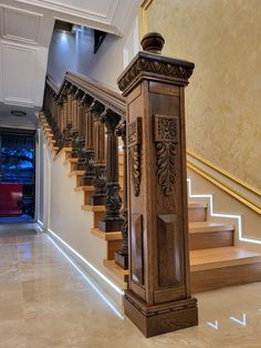 an ornate wooden stair case in a home