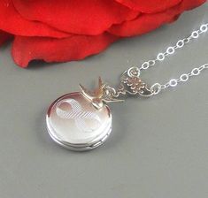 This infinity locket is absolutely stunning. Sterling silver locket is decorated with sterling silver plated swallow sparrow. Locket is hanging from sterling silver plated floral link, and sterling silver chain and jump spring. Locket is 22 mm in size. It has a room for two photos inside. Please note: I DO NOT DO ENGRAVING OR INSERT PICTURES! Thanks for looking:) ~Mani Infinity Locket, Blue Stones Jewelry, Necklace Infinity, Necklace Locket, Celtic Earrings, Necklaces Handmade, Sterling Silver Locket, Infinity Pendant, Infinity Jewelry