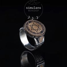 This exquisite Mystic Solomon's Seal Ring is a beautifully crafted piece made from 925 sterling silver. The focal point of the ring features the mystical Seal of Solomon, known for its powerful metaphysical properties. It is believed to have the ability to command and repel metaphysical entities according to the wearer's desires. The sides of the ring are adorned with intricate engravings, hand-carved to perfection, and enhanced with black onyx stones, adding to its mystical allure. The detailed Spiritual Sterling Silver Signet Ring With Gemstone, Mystical Engraved Silver Rings, Vintage Silver Star Of David Jewelry, Mystical Sterling Silver Open Ring, Luxury Sterling Silver Star Of David Jewelry, Luxury Silver Star Of David Jewelry, Handmade Sterling Silver Luxury Engraved Ring, Luxury Handmade Sterling Silver Engraved Ring, Silver Star Of David Spiritual Rings