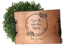 a wooden plaque with the words, just the adventure begins on it