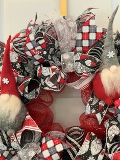 a christmas wreath with gnomes and snowflakes