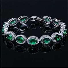 Simulated Emerald Stamped 925 Sterling Silver Bracelet. Made With Top Grade Cubic Zirconia That Is Cut To Shine Like Real Diamonds And Gemstones. Each Stone Has A Lot Of Depth And Sparkle. Bracelet Measures Approximately 7” Inches And Comes With A 1” Inch Extender Clasp. This Is A Beautiful Quality Bracelet! Brand New Condition And Comes In A Gift Box. Metal Type ~ Stamped 925 Sterling Silver Gemstone Type ~ Cubic Zirconia Bundle & Save: Bundle 2 Or More Items For A Private Discount Next Day Shi Silver Tennis Bracelet With Gemstones, Silver Crystal Bracelets With Gemstone, Silver Sterling Silver Tennis Bracelet For Party, Silver Crystal Bracelet With Gemstone, Sterling Silver Cubic Zirconia Party Bracelet, Party Sterling Silver Cubic Zirconia Bracelet, Party Sterling Silver Bracelet With Cubic Zirconia, Silver Tennis Bracelet For Party, Silver Crystal Gemstone Bracelet For Party