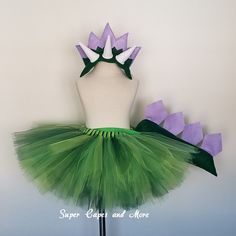 a green tutu skirt with purple flowers on it