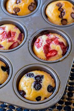 muffins with strawberries and chocolate chips in a pan