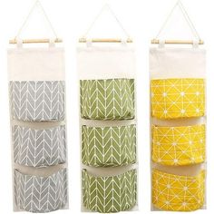 three hanging storage bags with different designs on them