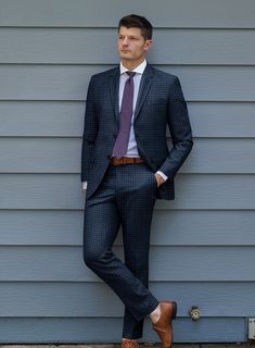 Hunting for a versatile suit can be quite overwhelming. However, our stylish and suave Reda Lapis Blue Checks Wool Suit is a must-have, as it has the power to elevate a simple orthodox outfit into something powerful. Made from high-quality wool fabric, the suit features a striking gingham checkered pattern created with black yarns over classic blue cloth, adding a touch of personality to this timeless design. Whether you are heading to an official meeting or an important gathering, this suit is Luxury Wool Plaid Suits, Luxury Timeless Plaid Suit, Luxury Plaid Blazer In Suiting Fabric, Luxury Plaid Wool Suit, Orthodox Outfit, Herringbone Tweed Jacket, White Oxford Shirt, Tweed Pants, Blue Tartan