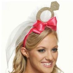 a woman wearing a pink bow and headband