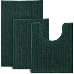 three dark green kitchen mats on white background