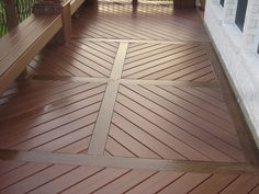 a wooden porch with two benches on it