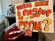 a sign that says wanna make a pisto at my prom? and some flowers