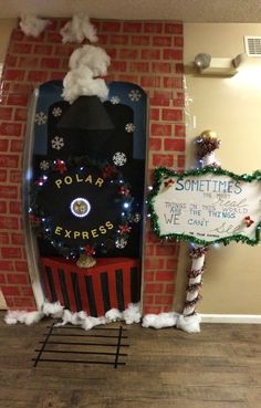 a fake polar express sign is in front of a door decorated with snowflakes