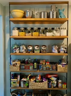 the shelves are full of food and containers