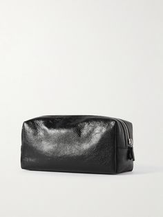 Part of Balenciaga's iconic 'Le Cagole' family, this pouch is made from textured black leather with silver-tone studs and matching buckles. Sized to keep your essentials together, it has a separate zipped pocket at the front for small valuables. Luxury Textured Leather Pouch, Black Leather Pouch Cosmetic Bag, Balenciaga Pouch, High-end Black Pouch Bag, Balenciaga Piercing Bag, Balenciaga Belt, Leather Wash Bag, Balenciaga Men, Black Balenciaga