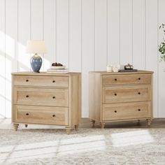 two wooden dressers sitting next to each other on top of a carpeted floor