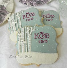 two decorated cookies sitting on top of a table