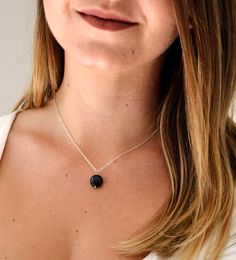 Shungite is estimated to be over 2 billion years old and found in the Karelia Region of Russia. It is said to help detoxify and purify the body by absorbing and eliminating any negative energies and clearing dysfunctional patterns. It is also believed to be a psychic protection stone and useful in protection from EMFs.This necklace is handcrafted with a natural Shungite stone in a smooth polished coin shape. It can be made in sterling silver or 14k gold filled.MATERIALS- Natural, Genuine Shungit Holistic Black Necklace With Natural Stones, Black Holistic Necklaces With Natural Stones, Holistic Black Necklaces With Natural Stones, Gift Black Natural Stone Necklaces, Obsidian Gemstone Necklace For Gift, Black Onyx Jewelry For Meditation, Obsidian Natural Stones Necklace For Gift, Elegant Obsidian Jewelry For Healing, Black Obsidian Necklace For Gift