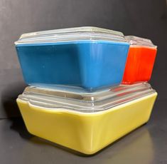 three plastic containers stacked on top of each other