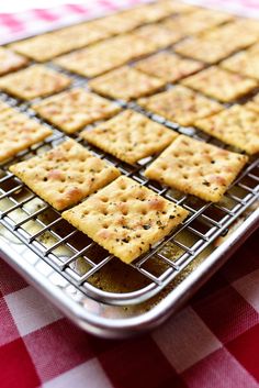 crackers cooling on a metal rack on a red and white checkered tablecloth