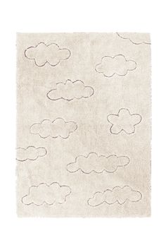 a white rug with clouds on it