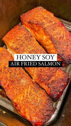 honey soy air fried salmon in an air fryer with text overlay that reads, honey soy air fried salmon