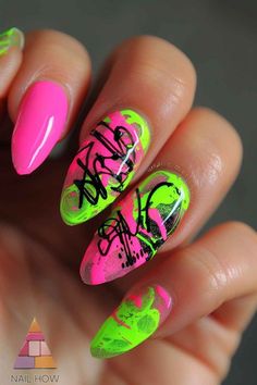 Striking neon pink and green color-blocked nails with black abstract designs. Daring yet chic neon nail inspo perfect for summer nights out. Recreate these at nailhow.com. Nail Designs With Neon Green, Neon Green Gel Nail Designs, Hot Pink And Green Nails, Neon Pink And Green Nails Acrylic, Green And Pink Neon Nails, Neon Pink And Green Nails, Neon Green And Pink Nail Designs, Pastel Nail Colors, Neon Nail Art Designs