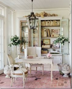 an image of a living room with furniture and bookshelves on the shelves in it