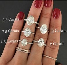 a woman's hand with five different engagement rings on it and the price is $ 5