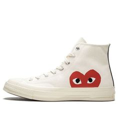 The Comme des Garçons x Chuck Taylor All Star Hi is a must-have sneaker for fashion-savvy individuals. The Off-White canvas upper and red CDG heart logo on the side panels are both stylish and eye-catching, while the vulcanized rubber midsole provides comfort and support. Released in June 2017, this sneaker is also available in a black colorway. (SNKR/Unisex/High Top/Crossover/Kawakubo Rei) Casual High-top Sneakers With Logo-print Tongue And White Sole, Canvas High-top Sneakers With Logo Print, Red Casual Sneakers With Embroidered Logo, Casual Red Sneakers With Embroidered Logo, Casual High-top Sneakers With Red Sole, Red High-top Sneakers With Logo-print Tongue, Converse High-top Sneakers With Logo Print, Casual High-top Sneakers With Logo-print Tongue, Casual High-top Lace-up Sneakers With Embroidered Logo