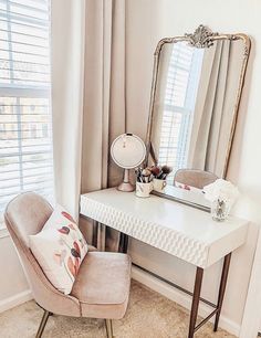 a white desk with a mirror, chair and lamp