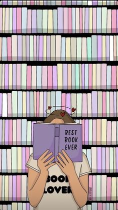 a girl is reading a book in front of a bookshelf full of books