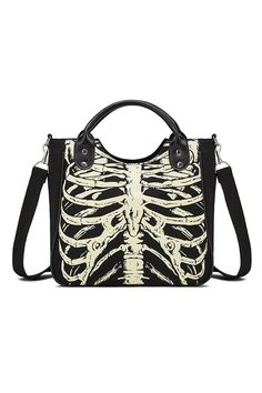 Free shipping in the US and worldwide. Length: 36 cm (14.17 in); Height: 38 cm (14.96 in); Width: 14 cm (5.51 in) . Discover the perfect blend of eerie elegance and practical functionality with our Skeleton Bones Print Luminous Canvas Handbag . Crafted from high-quality canvas material, this striking black handbag features a unique white luminescent skeleton bones print that glows in the dark, making it an essential accessory for any Goth aesthetic lover. High-Quality Canvas Material: Made from durable canvas, this handbag promises long-lasting use and can withstand daily wear and tear. Luminescent Skeleton Bones Print: The unique skeleton bones print glows in the dark, adding a spooky yet stylish element to your outfit. Spacious and Practical: With ample space, this handbag can hold all y Gothic Backpacks, Punk Mode, Skull Bags, Patterned Backpack, Retro Mode, Canvas Handbags, Shoulder Messenger Bag, Canvas Shoulder Bag, Shoulder Tote Bag