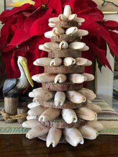 a christmas tree made out of seashells on a table