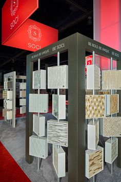 an exhibit with many different types of tiles on display at a trade show or exhibition