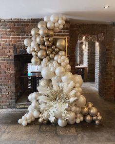 an arrangement of balloons and flowers in a room