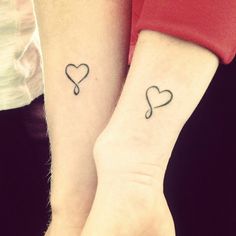 two people with matching tattoos on their arms