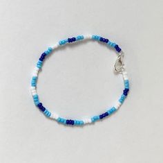 A bracelet with three different shades of blue!! Made with a stretchy string that fits all sizes! Casual Blue Hand-strung Beaded Bracelets, Casual Blue Hand-strung Stretch Bracelet, Casual Blue Beaded Stretch Bracelet, Adjustable Blue Stretch Bracelet With Colorful Beads, Adjustable Beaded Blue Stretch Bracelet, Adjustable Blue Beaded Stretch Bracelet, Casual Blue Hand-strung Bracelets, Handmade Casual Blue Stretch Bracelet, Adjustable Blue Friendship Bracelets With Colorful Beads