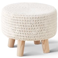 a small white stool with wooden legs