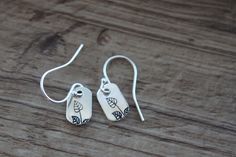 Tiny Sterling Silver Leaf Earrings / Dangle Drop Earrings / Hand Stamped Earrings / Minimalist /Dainty Earrings / Nature lover Earrings gift Hand stamped Stem branch by myself. Finish : Sterling Silver rectangular shape  (1/4 x 3/8 inches ) Length : 1 inch including the Sterling Silver ear wires Ear wire : Sterling silver ear wires Sterling Silver Earrings : https://www.etsy.com/shop/NtikArtJewelry?ref=seller-platform-mcnav&section_id=36490616 PLEASE CHECK ALL THE PICTURES AND DESCRIPTIONS FOR ACCURATE SCALE. Thanks for looking Everyday Single Dangle Flower Earring, Everyday Drop Flower Earrings For Pierced Ears, Sterling Silver Flower Drop Earrings For Everyday, Everyday Sterling Silver Flower Drop Earrings, Everyday Flower Drop Earrings, Everyday Adjustable Dangle Flower Earrings, Adjustable Nickel-free Flower Earrings For Everyday, Nickel-free Drop Flower Earrings For Everyday Wear, Everyday Nickel-free Dangle Flower Earrings