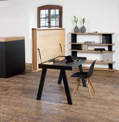 a black table and chair in a room