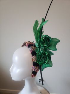 Those events when you want to be simple but not unnoticed. This headband is padded, we carefully hand beaded it with multi colored beads/sequence and neatly topped it with bow made with sinamay, roses, feather and ostrich quill spine. This is a limited edition, grab it before it is gone. Adjustable Headpiece For Mardi Gras Party, Whimsical Tall Crown Headpiece For Party, Elegant Crown Hair Accessories For Parties, Adjustable Headpiece For Party And Carnival, Adjustable Crown Costume Hat For Party, Whimsical Structured Crown Headpiece For Party, Adjustable Headband Headpieces For Costume Party, Glamorous Adjustable Party Headpieces, Fitted Evening Headband